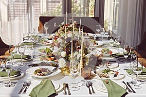 Elegant chamber table setting with candles and flowers aesthetics design under shadows. Provence wedding style