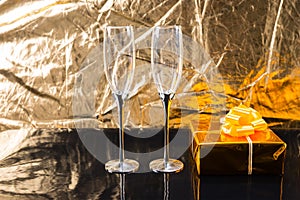 Elegant Champagne Glasses and Golden Gift