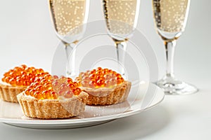 Elegant Champagne Toast with Gourmet Salmon Caviar Tartlets