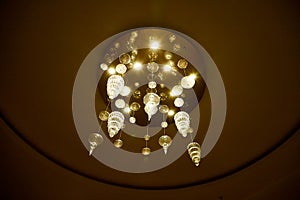 Elegant chandelier on the ceiling of big hall