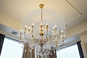 Elegant chandelier on the ceiling in a luxury restaurant