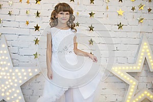 Elegant child in a white dress