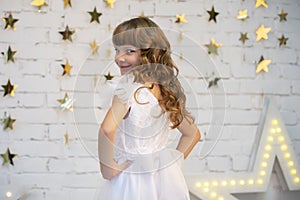 Elegant child in a white dress