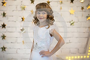 Elegant child in a white dress