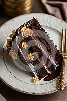 Elegant Chocolate Ganache Cake with Cream Roses photo