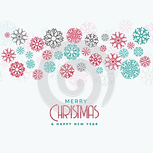 Elegant christmas background with colorful flowing snowflakes