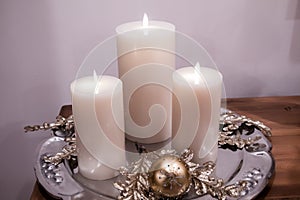 Elegant Christmas Candles on a Silver Plate