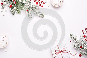 Elegant Christmas frame of decorations, fir on white background, copy space.