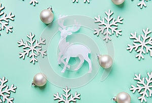 Elegant Christmas New Year Greeting Card Poster White Reindeer Snow Flakes Balls Pattern on Turquoise Blue Background.