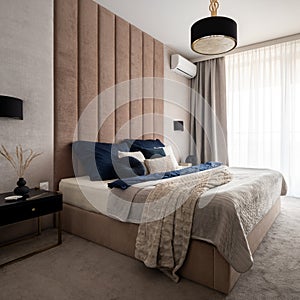 Elegant and classy bedroom with upholstered wall photo