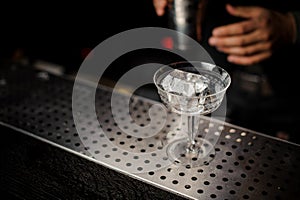 Elegant cocktail glass filled with fresh alcoholic drink