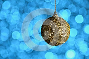 Gold,yellow, New Year and Christmas ball on blue background with