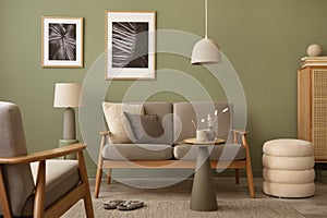 Elegant composition of living room interior. Modern scandi sofa, design pillows, side table, rattan commode and creative personal