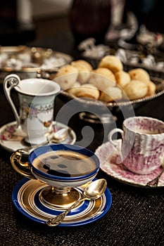 Elegant cooffe cup on a dark wooden table. photo