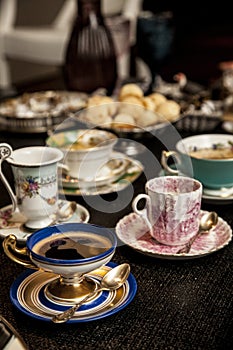 Elegant cooffe cup on a dark wooden table. photo