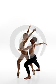 Elegant couple dancing ballet dance in studio