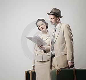 Elegant couple leaving with luggage