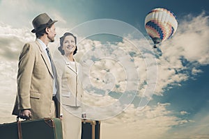 Elegant couple leaving with luggage