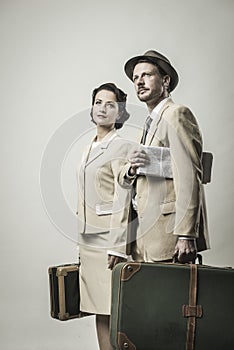 Elegant couple leaving with luggage