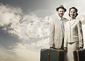 Elegant couple leaving with luggage