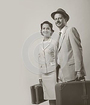 Elegant couple leaving with luggage