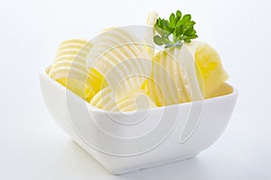 Elegant curls of fresh butter in a small dish
