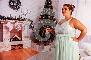 Elegant, curvy woman lets the Christ Child come