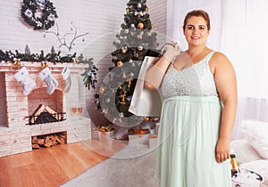 Elegant, curvy woman with shopping bags