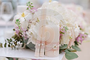 Elegant decoration of wedding candles with a lace for the marriage ceremony