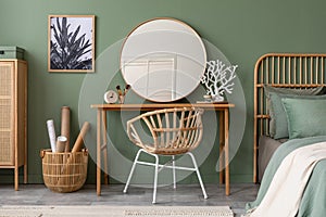 Elegant details of modern interior design with wooden sideboard, bed, mirror, painting and stylish personal accessories. Green