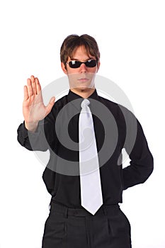 Elegant determined young businessman showing stop