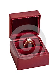 An elegant diamond ring presented in a classic red velvet box isolated on white background, created by Generative AI