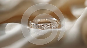 Elegant Diamond Ring Rests on Soft Beige Fabric
