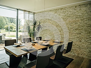 Elegant Dining Room with Stone Wall and Modern Furniture