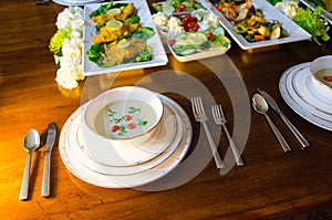 Elegant dinner buffet with soup, fish and vegetables