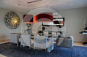 Elegant Dinning Space with Red Ceiling Lampshade