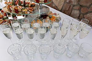 Elegant display of champagne glasses arranged for a wedding toast, sparkling white wine for a celebratory moment