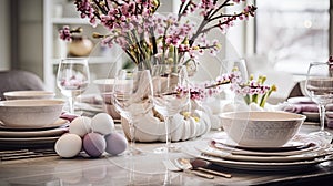 Elegant Easter table setting with pastel eggs, spring flowers, and fine china in a bright dining room