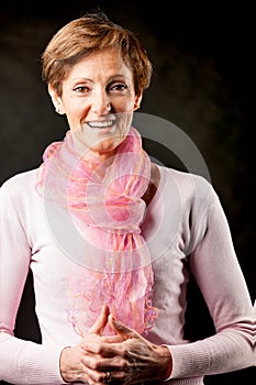 Elegant elderly lady, cat eyes, pink attire