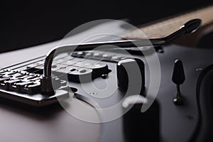 Elegant electric guitar close up view from body