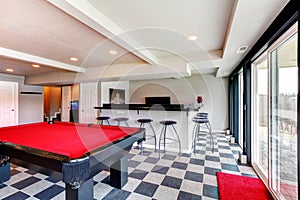 Elegant entertainment room with pool, bar and fireplace