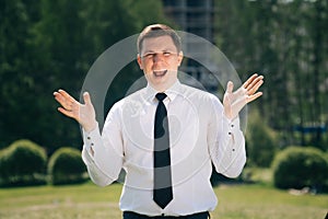 Elegant european surprised man in business clothes on a background of construction