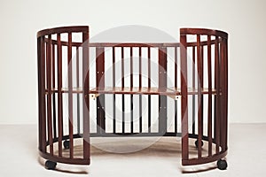 Elegant expensive bed for newborn baby. Luxury decorations of apartments