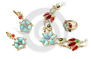 Elegant and fashion jewellery golden set of rings, earrings and necklace with rubies, sapphires, emeralds, turquoise and diamonds