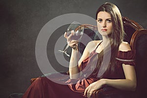 Elegant fashion woman with wineglass photo