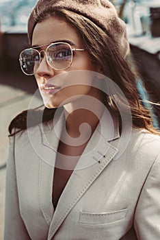 elegant fashionable girl posing in beige