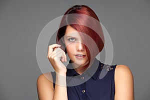 Elegant female fashion model with short red hair photo