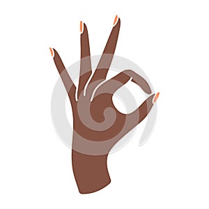 Elegant female hand with a sign approx. Okay gesture. Arm with wrist and fingers of a black woman. Non-verbal language