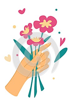 Elegant female hands holding flowers. Cut flowers. Decorative bouquet, floristic composition with leaves and flourishing.