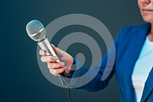 Elegant female journalist conducting business interview